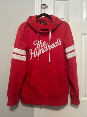 The Hundreds Red Hoodie with White Script and Sleeve Stripes